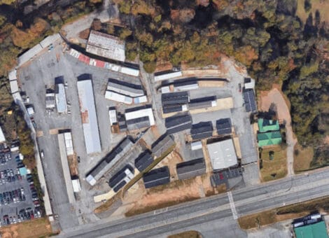 Aerial view of industrial complex near highway