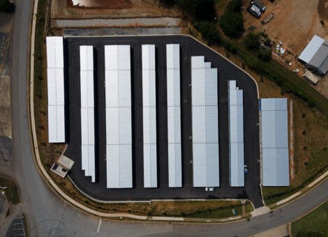 Aerial view of multiple 100×200 steel buildings arranged in a commercial layout, emphasizing scalability and durability for business applications.