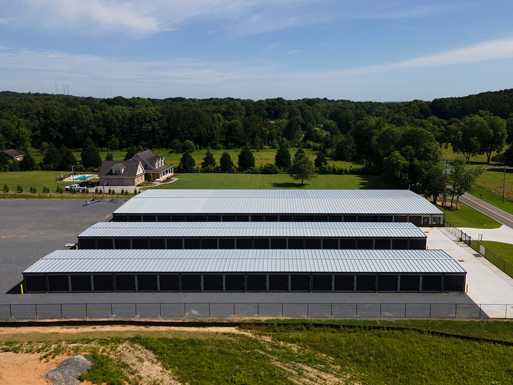 Steel mini storage buildings with dozens of bays with roll up doors