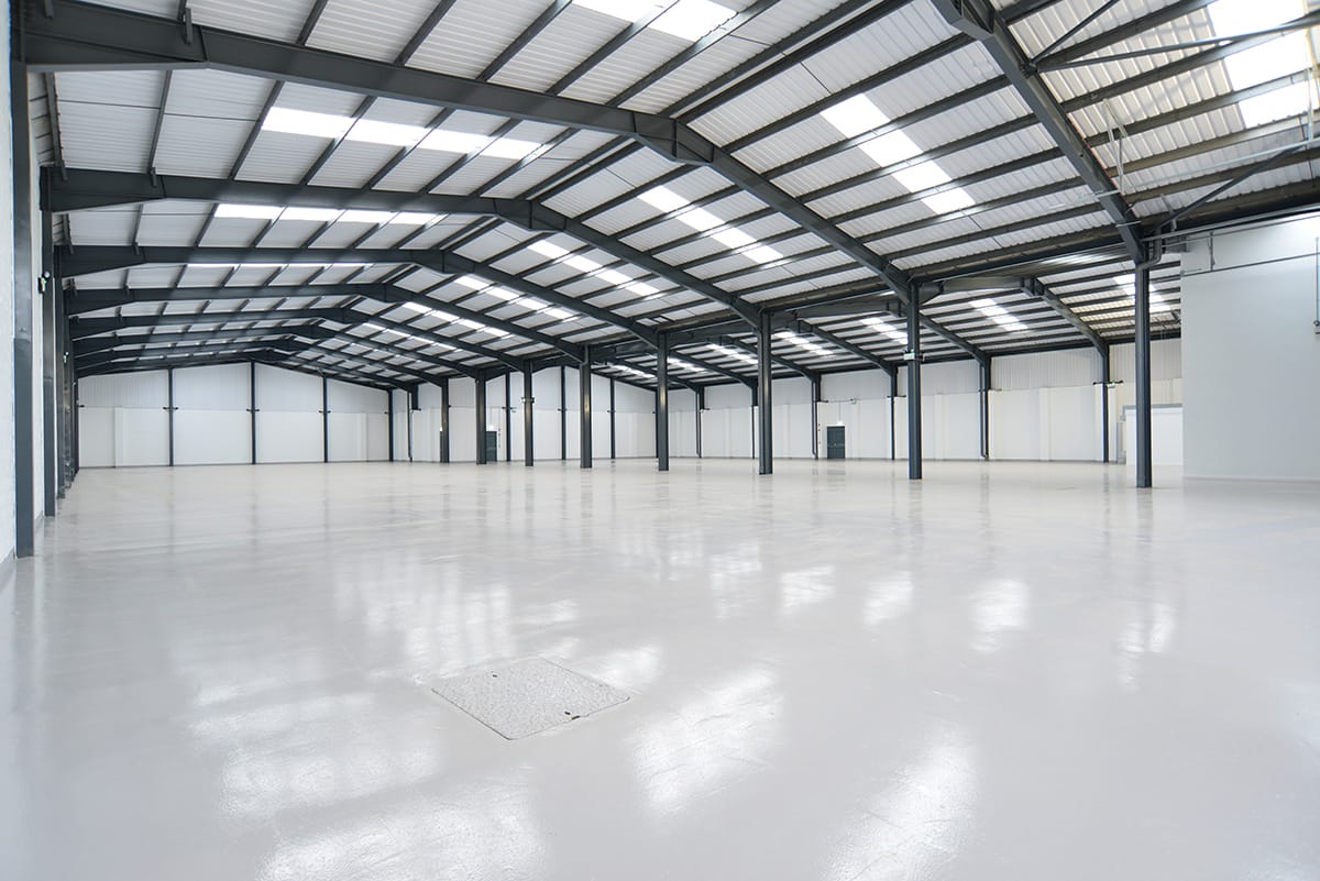Spacious empty industrial warehouse interior