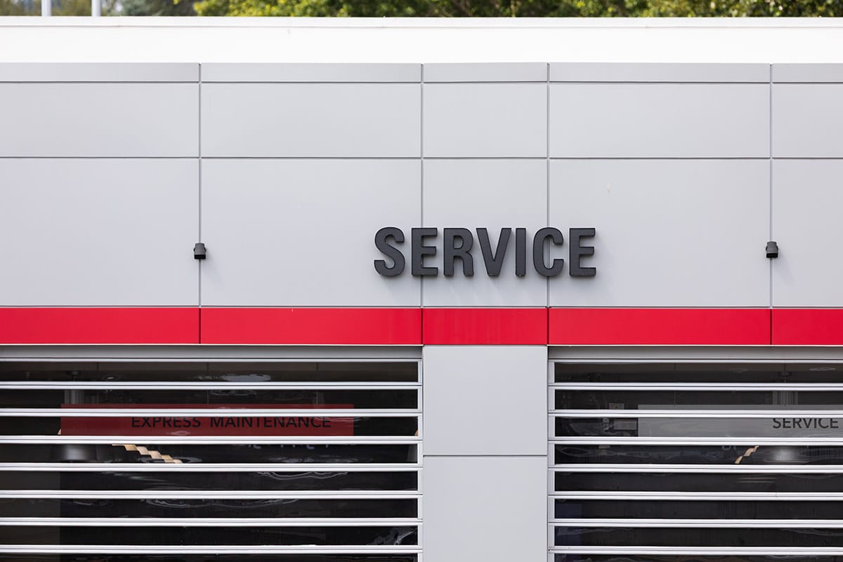 Auto service center exterior with red stripe