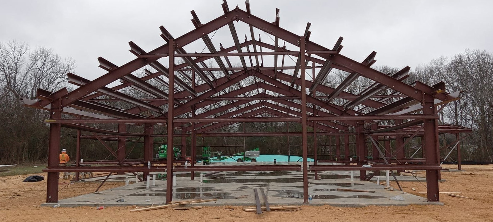 Steel frame building under construction on slab
